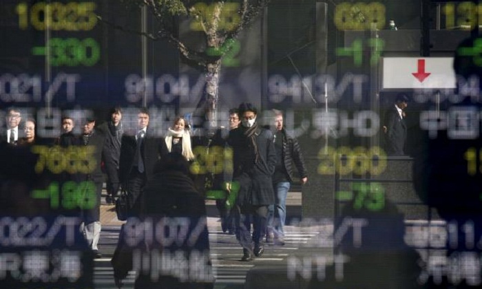 Asian shares skid to 2011 levels as oil slump intensifies